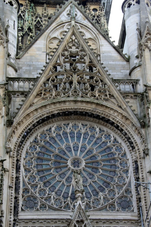 a closeup of the large window of an old church