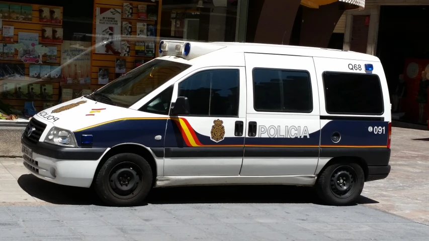 an empty van parked in front of a building