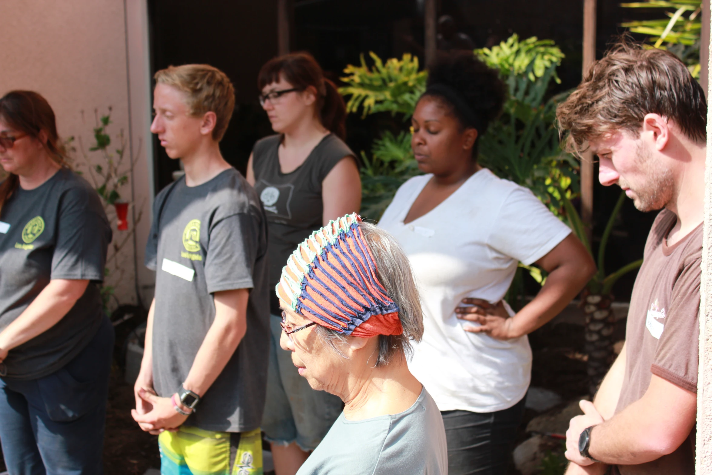 a group of people wearing headdress and sunglasses