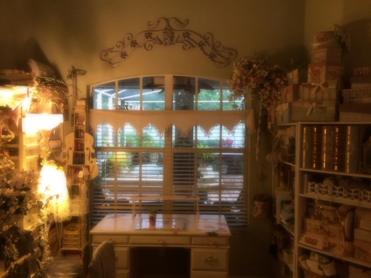 a decorated christmas tree and window in a corner with wooden shutters