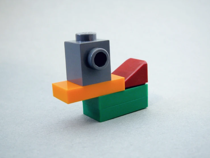 toy gun on an object that appears to be made out of lego blocks