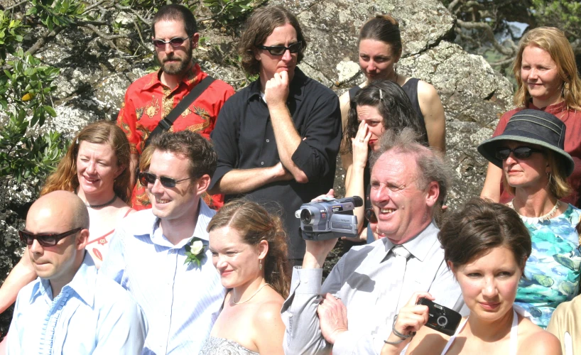 a group of people are posing for a po together