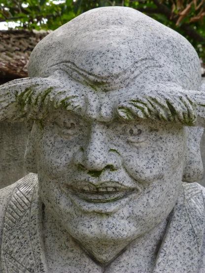 a close up of a face of a statue