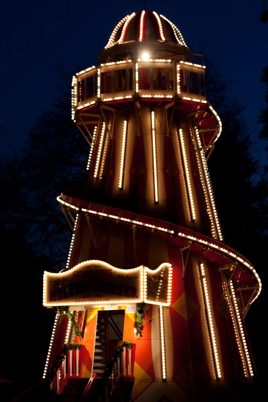 a very tall tower with some lights on it