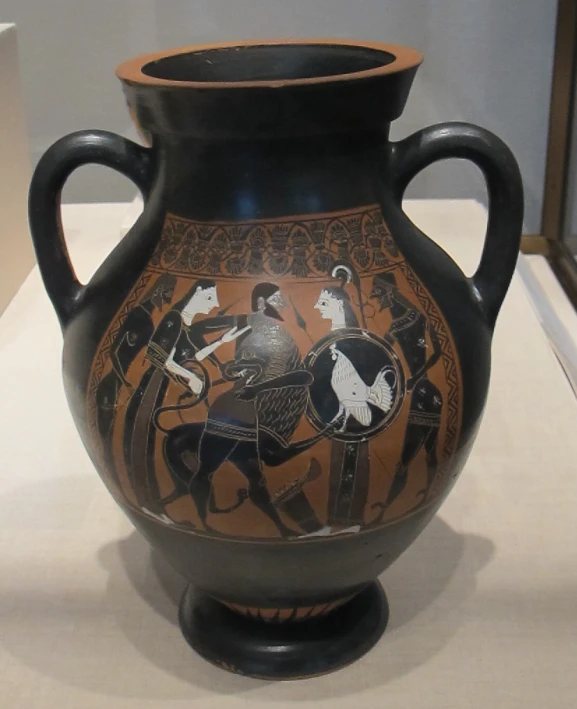 an old style vase sitting on display at a museum