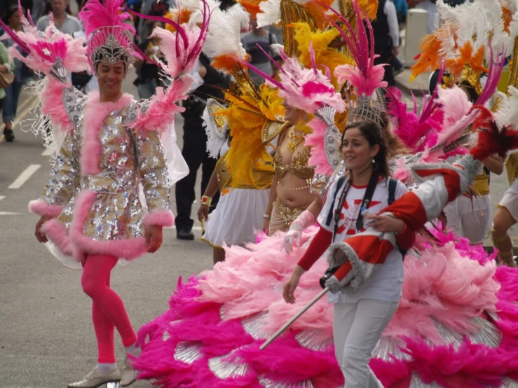 several young ladies dancing in different colored costumes