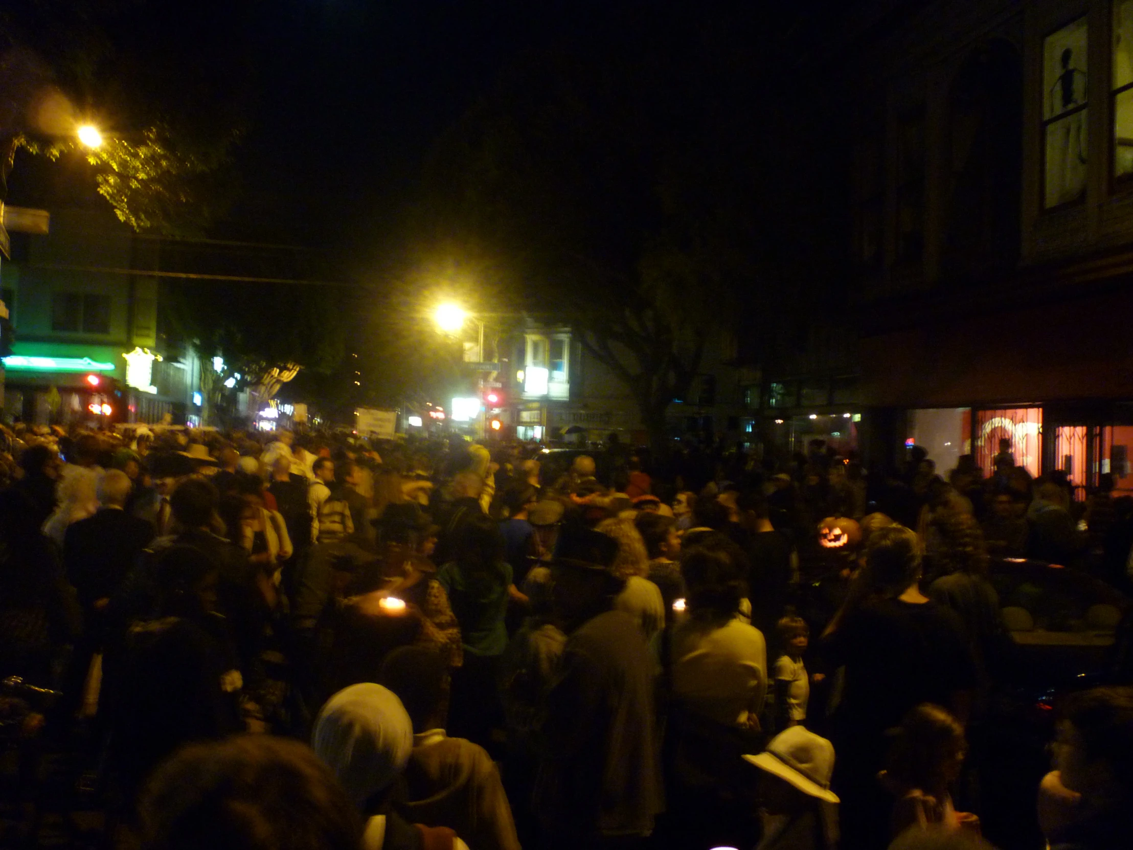 people are gathering in a crowded city street