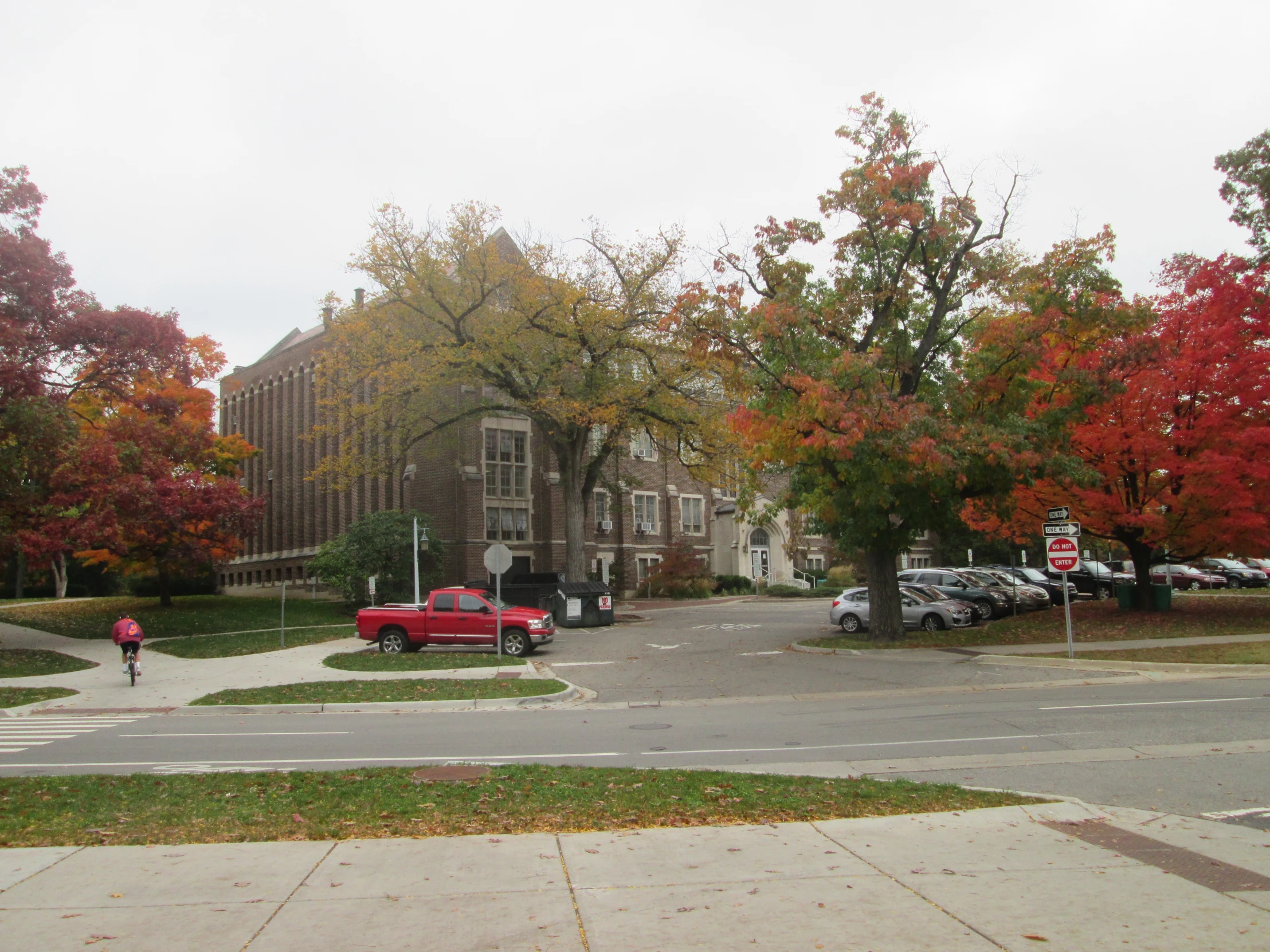 a street is lined with houses and cars