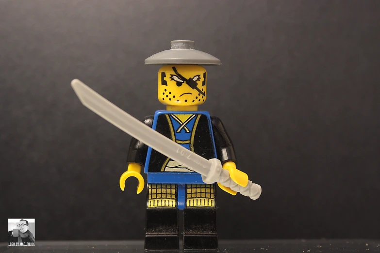 there is a lego figure that is holding a knife