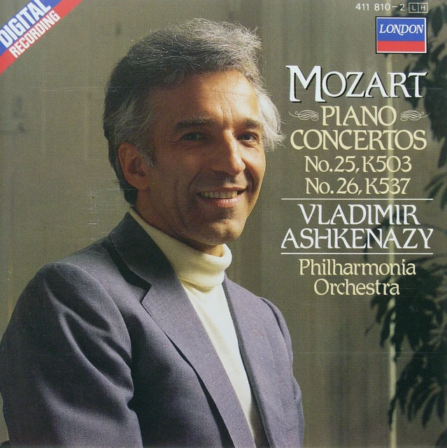 the front of a music album with a man in a suit and a white shirt