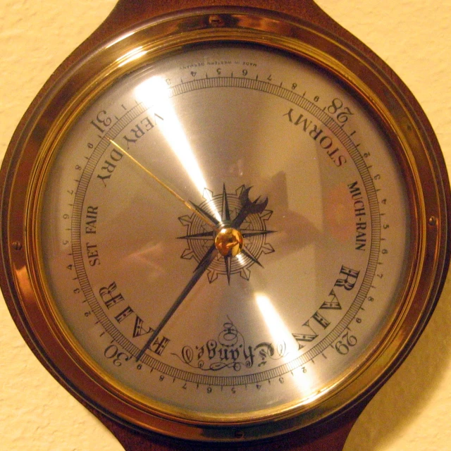 a ss clock mounted on the wall