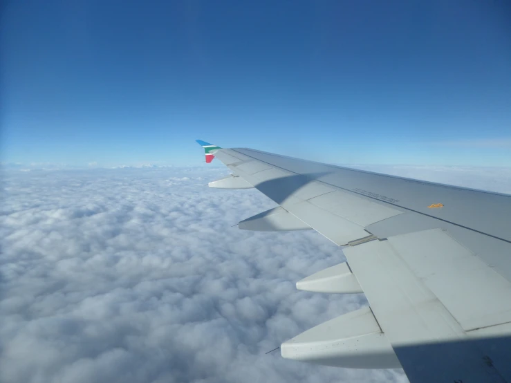 a view from a plane flying high above the clouds