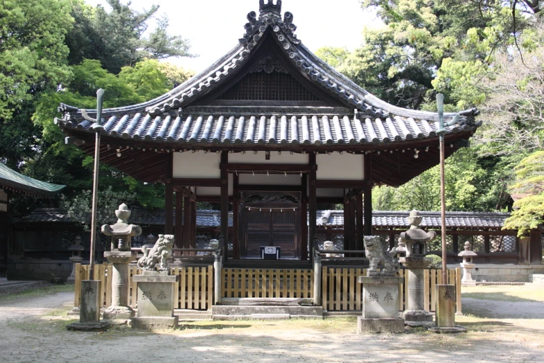 an outdoor area with asian style decor and statues