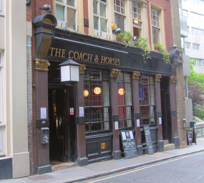 an exterior view of a restaurant with brick pillars