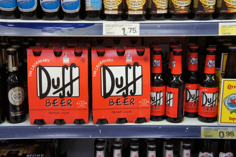 a shelf of alcohol is displayed in an aisle