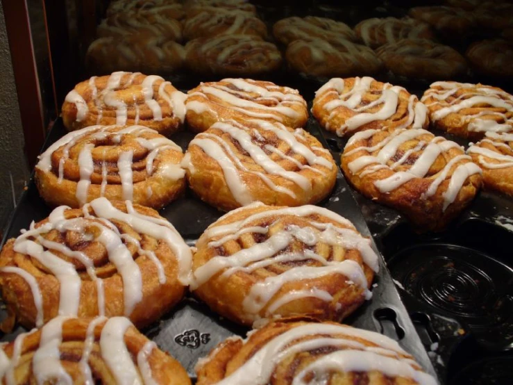 a bunch of doughnuts are shown in a display case