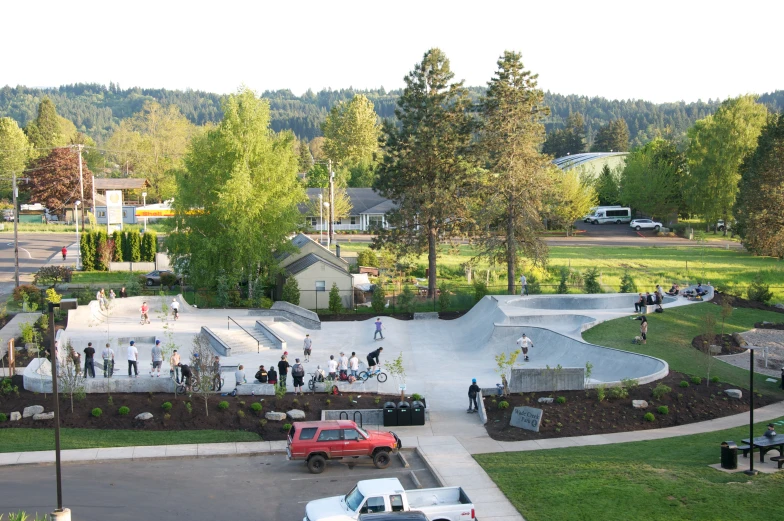 people skateboard around a large skate park