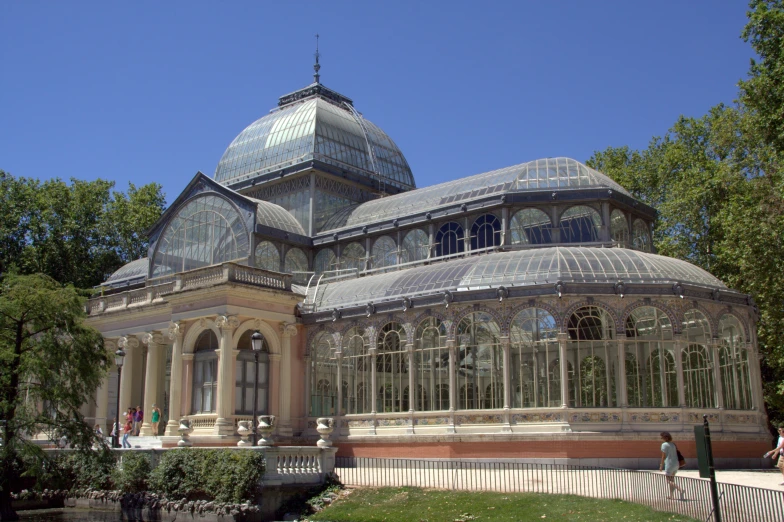 large house that has many glass and steel pieces on top