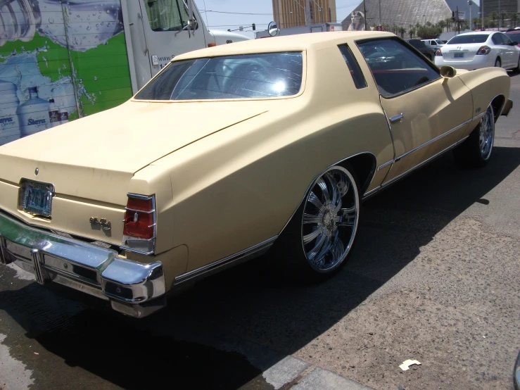 a yellow car parked in the middle of some street