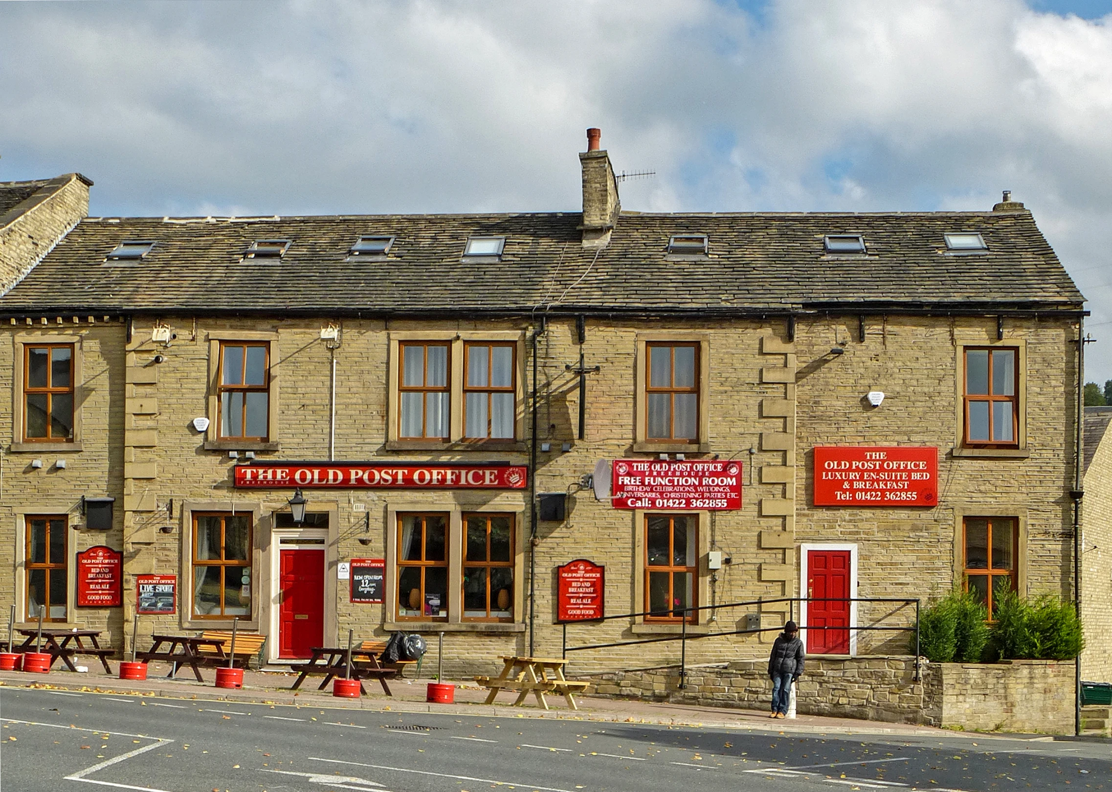 an old stone building is shown on the street