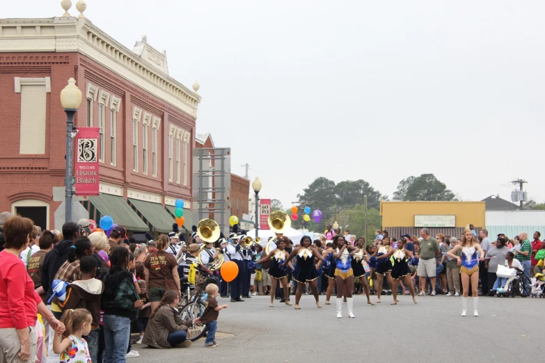 a group of women are performing in a parade