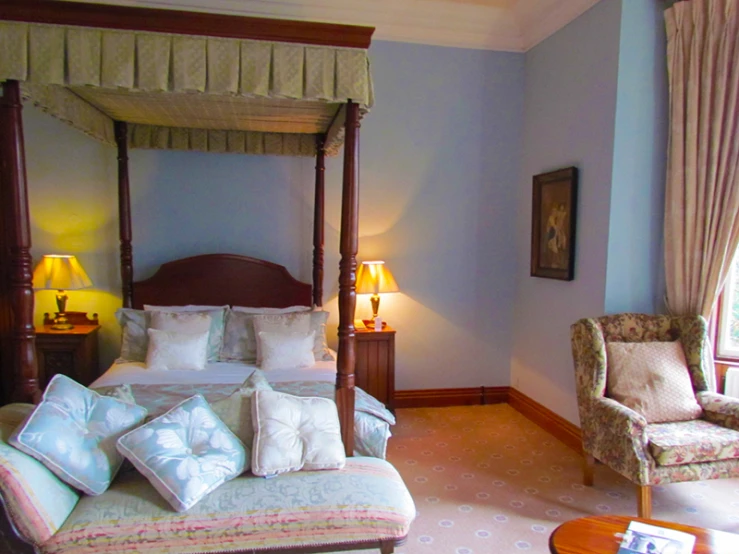 this bedroom features blue walls and white decor