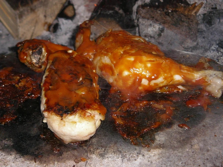barbecued chicken that has been covered in barbecue sauce