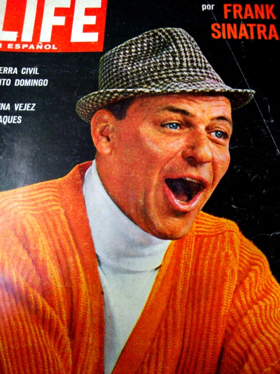 a man with his tongue out on a magazine cover