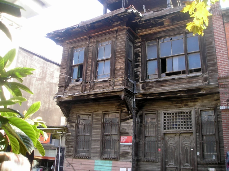 an old building with wooden balconies is pictured in front