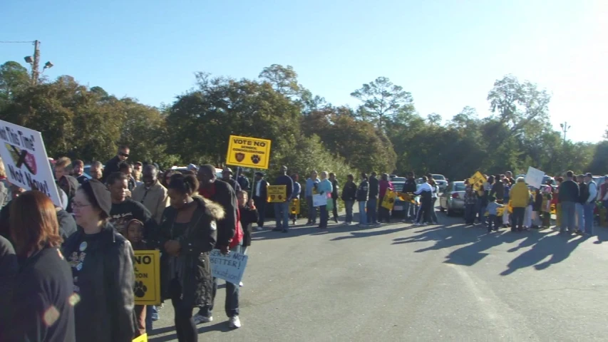 a large group of people are lined up on the street