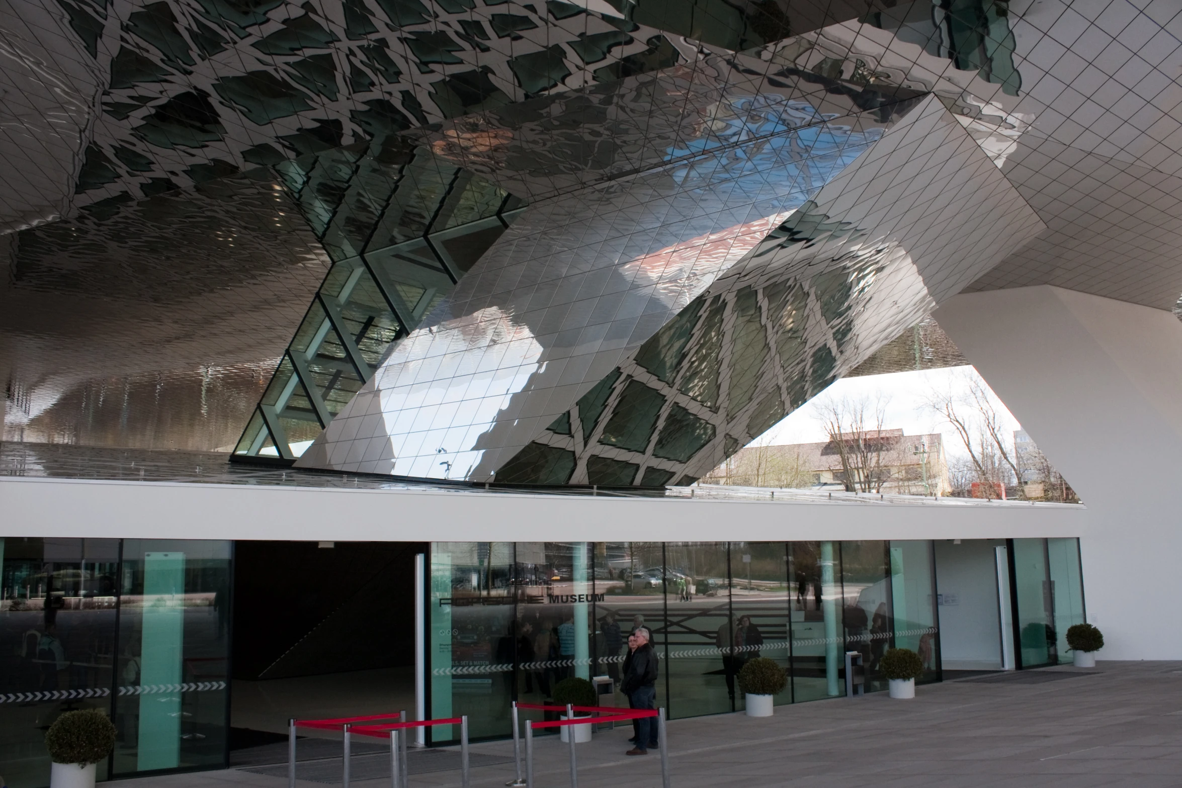 an image of a large mirror building reflecting the sky