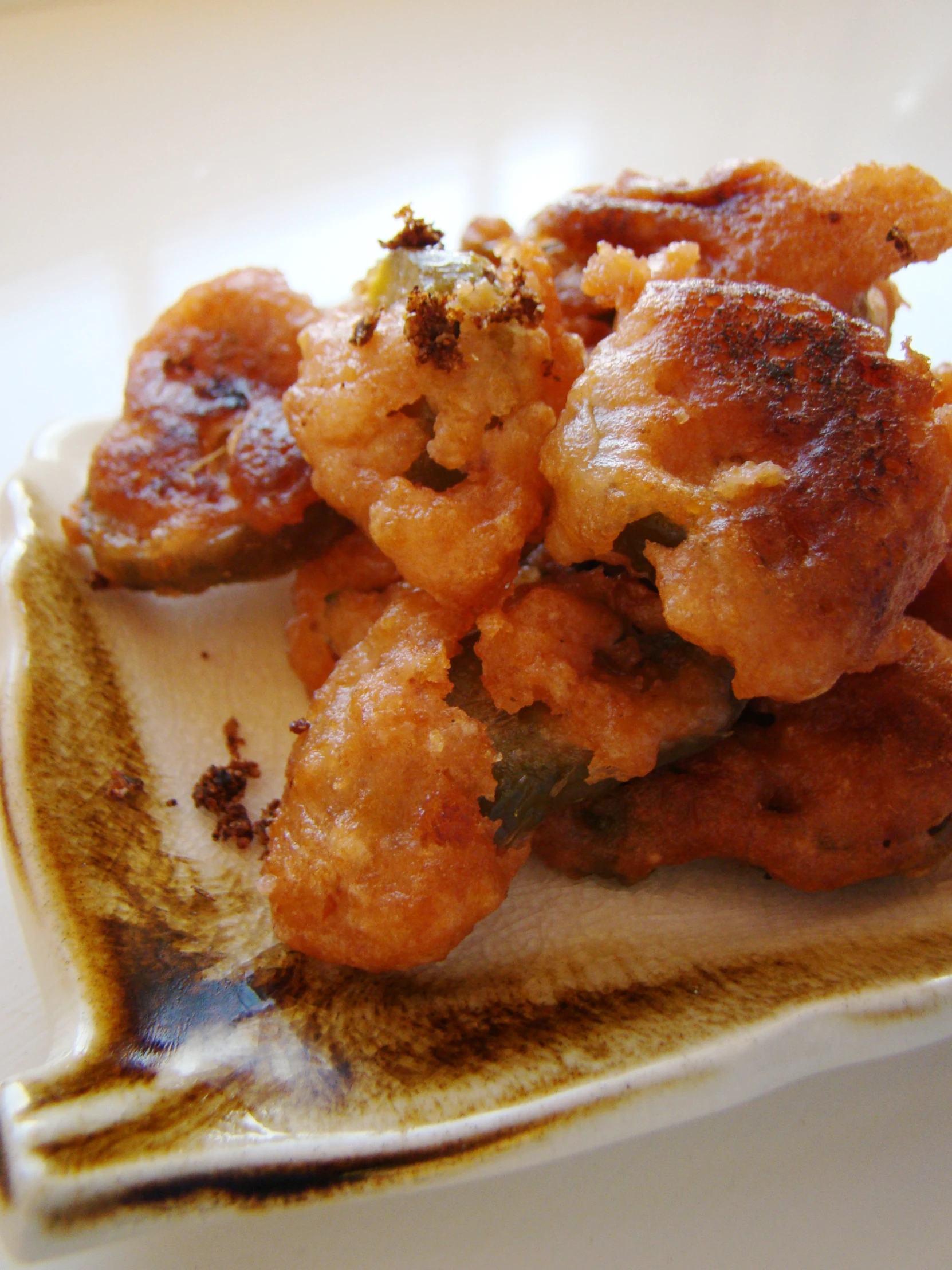 food on a plate sitting on a white table