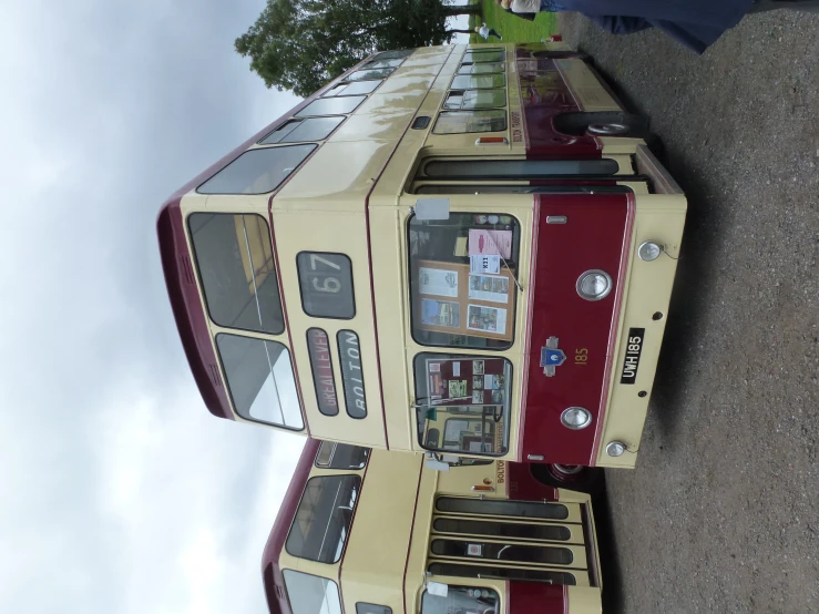 two double decker buses sitting in the parking lot