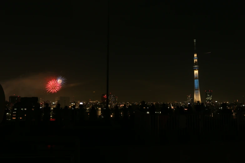 view of fireworks over a city at night