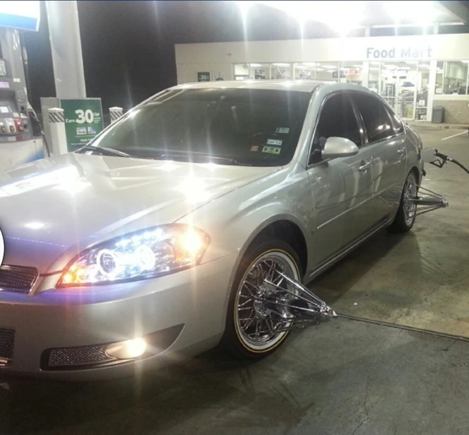 a car is sitting at a gas station