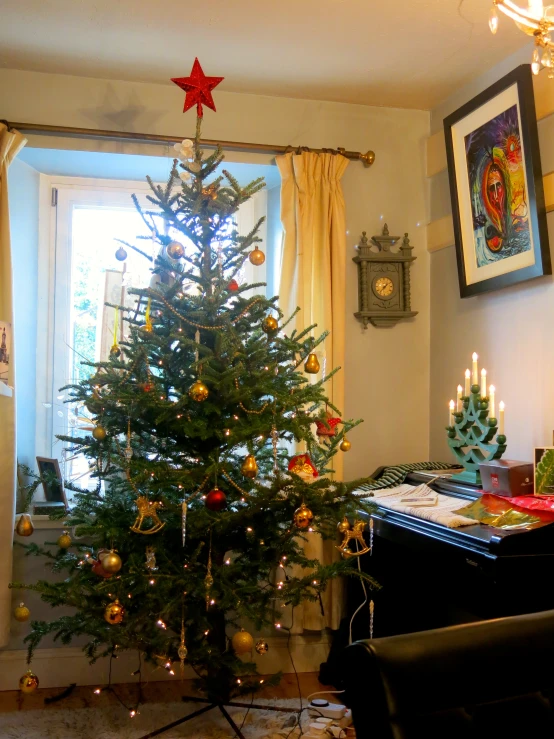 a christmas tree in a room with christmas decorations