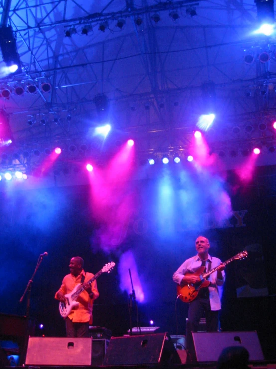 people in concert with purple and blue lights