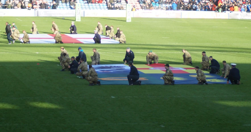 group of military soldiers standing on a field