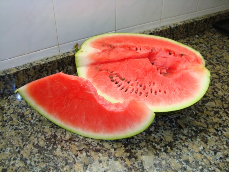 a closeup view of sliced watermelon in the sink