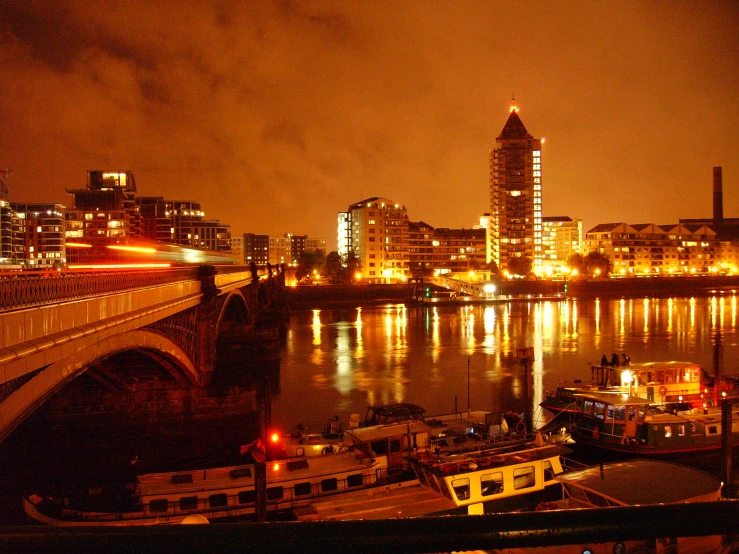 some boats and buildings by a body of water