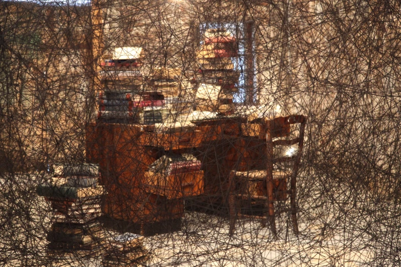 a small desk in an old room with a chair