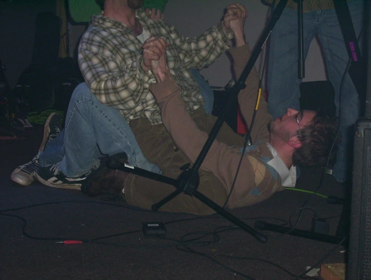 the two men are trying to dance on the stage