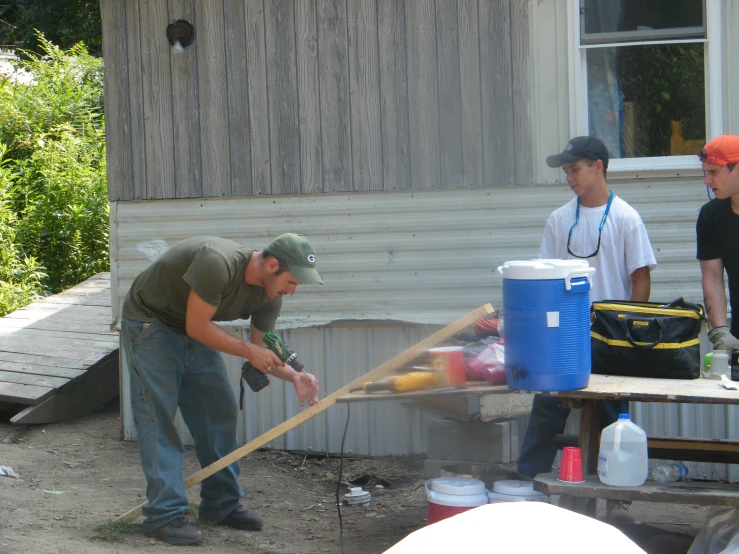 two men are cleaning up the house together