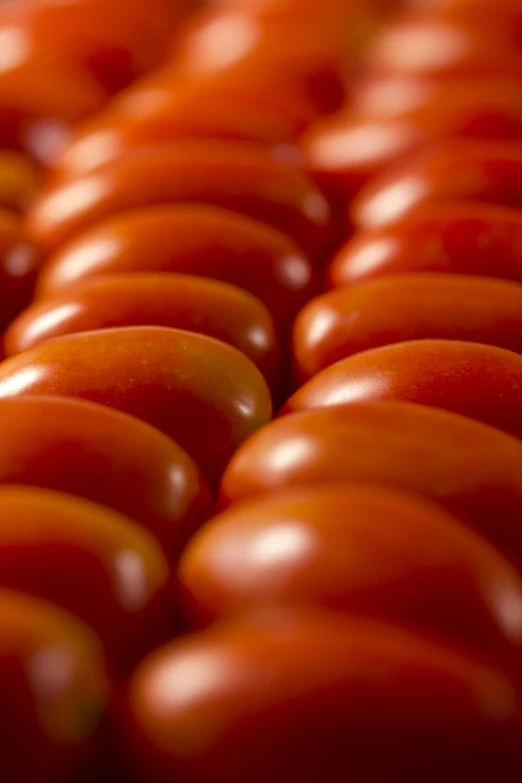 an assortment of tomatoes are piled on top of each other