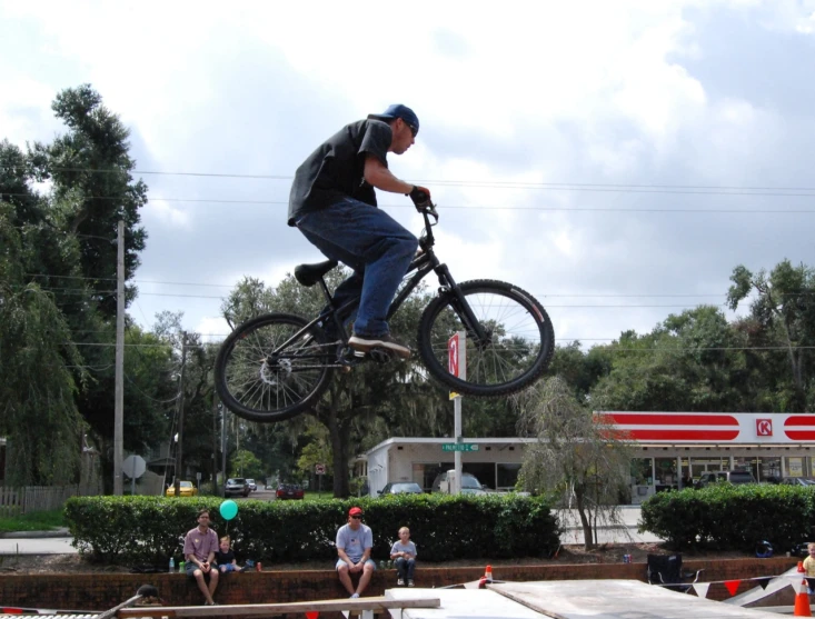 a man that is in the air with a bicycle