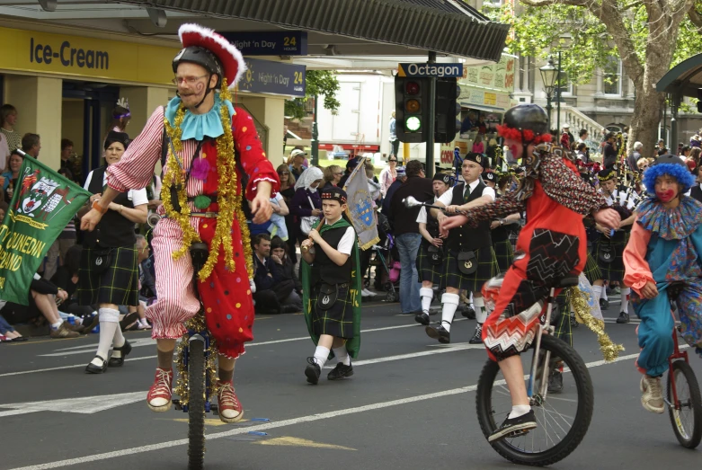 a parade being performed with people on bicycles