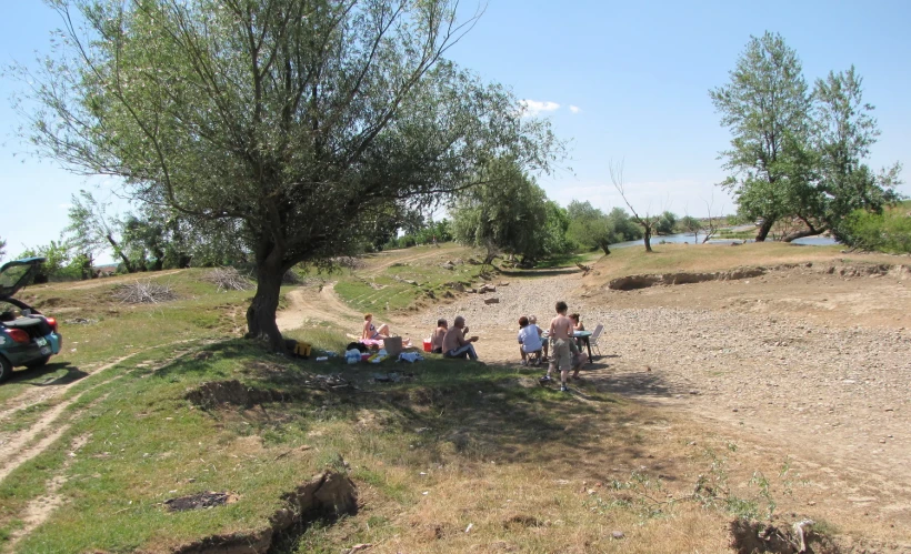 a group of people on bikes ride on a trail