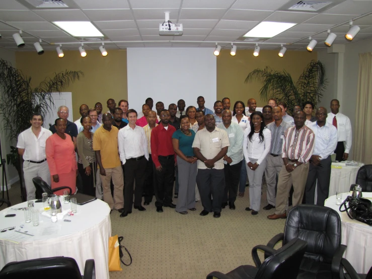 a group of men standing together in a room