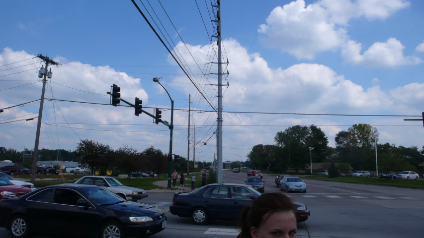 a busy city street intersection filled with cars