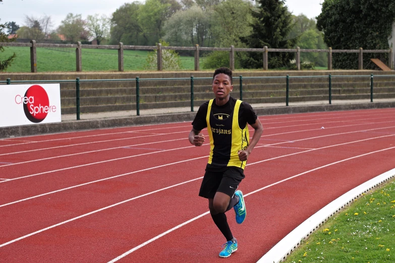 a man running on a running track